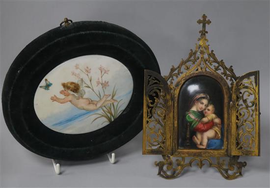 A Religious framed panel and circular putti panel 19.5cm, 20.5cm